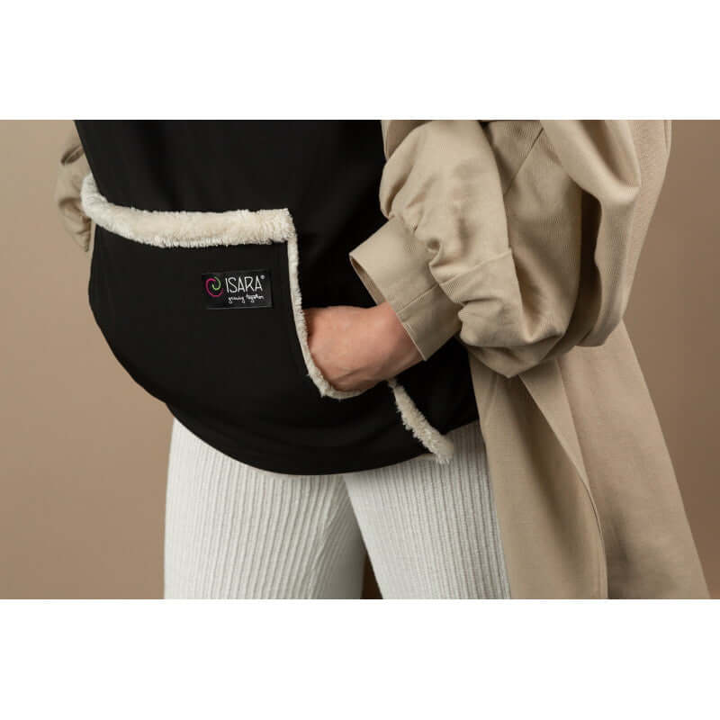 Isara Winter Baby Carrier Cover - Ultra Black close-up showing soft fleece lining and pocket detail | Babymaxi
