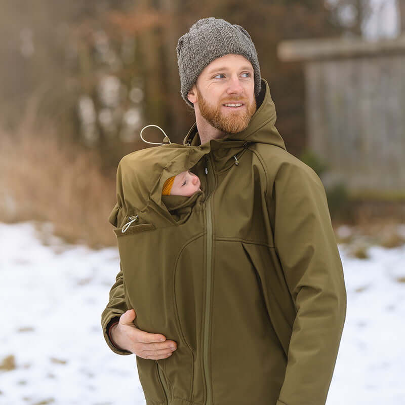 Mamalila Softshell Allrounder Babywearing Jacket for men - Khaki worn by man with baby in snowy setting | Babymaxi