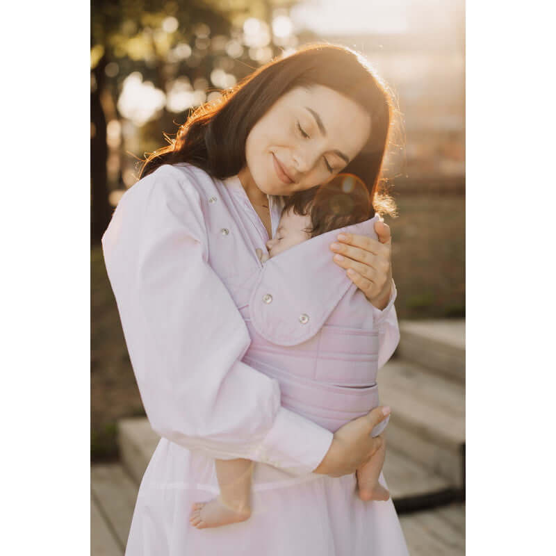 Woman wearing Marsupi Breeze - Lilac baby carrier, securely holding her baby for comfort and support | Babymaxi