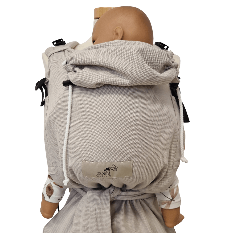 Storchenwiege Talemo Half-Buckle Baby Carrier - Moonstone on a doll showing adjustable design | Babymaxi
