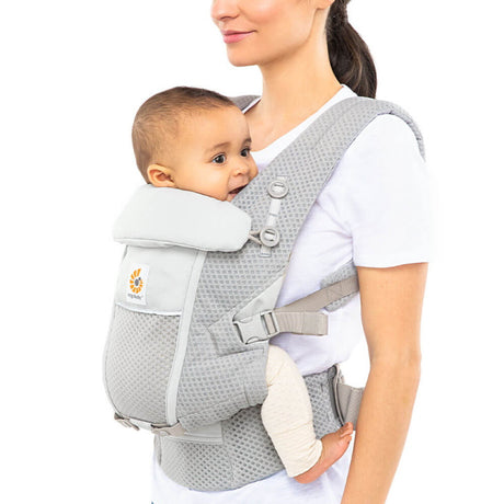 Mom carrying baby in Ergobaby Adapt SoftFlex Mesh Pearl Grey carrier, designed for comfort and breathability | Babymaxi