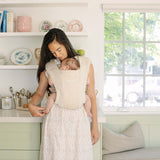 Ergobaby Embrace, Cosy Carrier - Cream in use, mother holding baby, soft and comfortable babywearing | Babymaxi