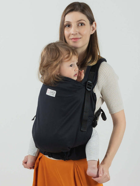 Isara Preschooler (up to 30kg) - Noire adjustable baby carrier being used by a parent with child | Babymaxi