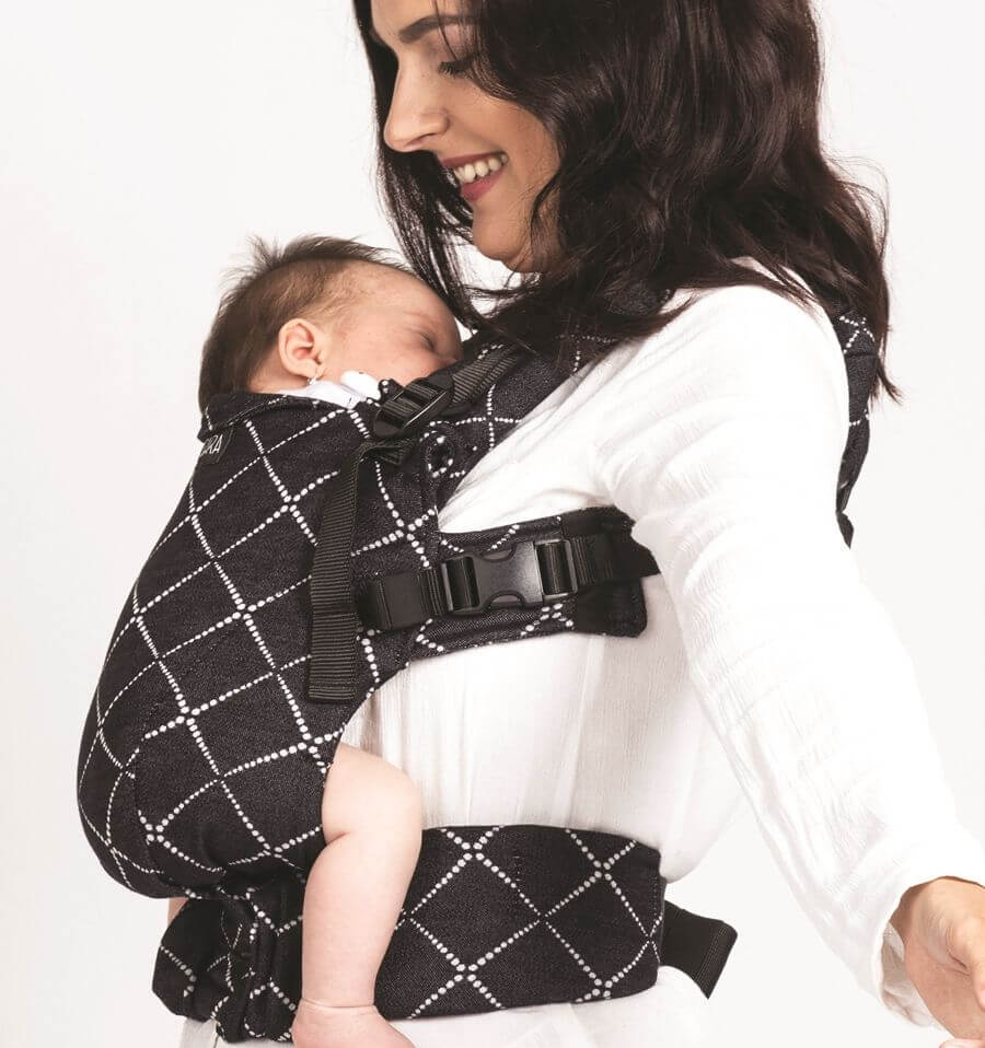 Isara The One - Diamonda Black baby carrier with mother holding sleeping baby | Babymaxi