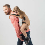Isara The One - Macchiato baby carrier with child on dad's back, perfect for all body types and family adventures | Babymaxi