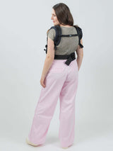 Isara The One - Noire ergonomic baby carrier worn by user, showcasing adjustable design for all body types | Babymaxi