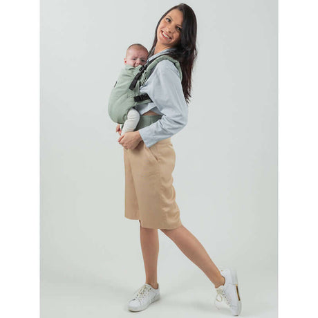 Isara The One - Sage Green Linen baby carrier in use, showcasing soft, breathable fabric for stylish babywearing | Babymaxi