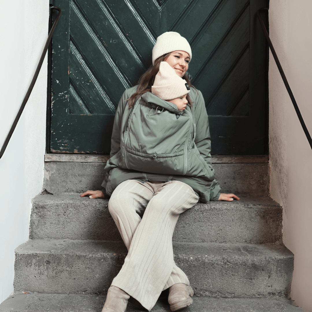 Mamalila Boston Babywearing Jacket - Agave in use, featuring a cozy design for babywearing and stylish comfort | Babymaxi