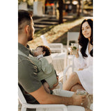 Marsupi Breeze - Pistachio baby carrier used by parents enjoying a sunny day outdoors with their baby | Babymaxi