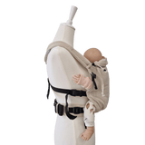 Stochenwiege Valeno Baby Carrier - Moonstone on mannequin with baby, showcasing ergonomic design and buckles | Babymaxi