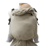 Storchenwiege Talemo Half-Buckle Baby Carrier - Natural showcased on a mannequin, highlighting its adjustable design and soft fabric | Babymaxi