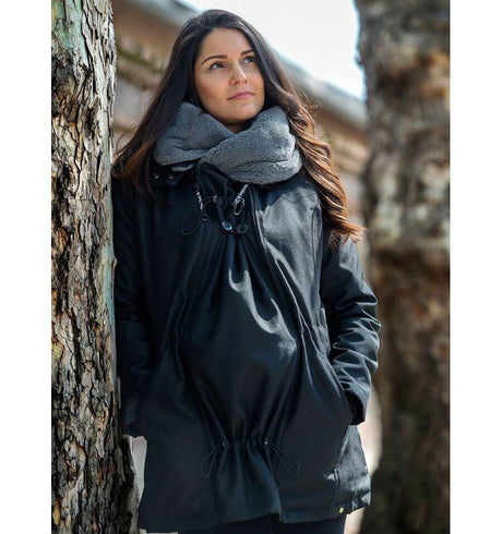 Wombat & Co. London - Wallaby Babywearing Jacket – Black & Charcoal worn outdoors, showcasing versatility and style | Babymaxi